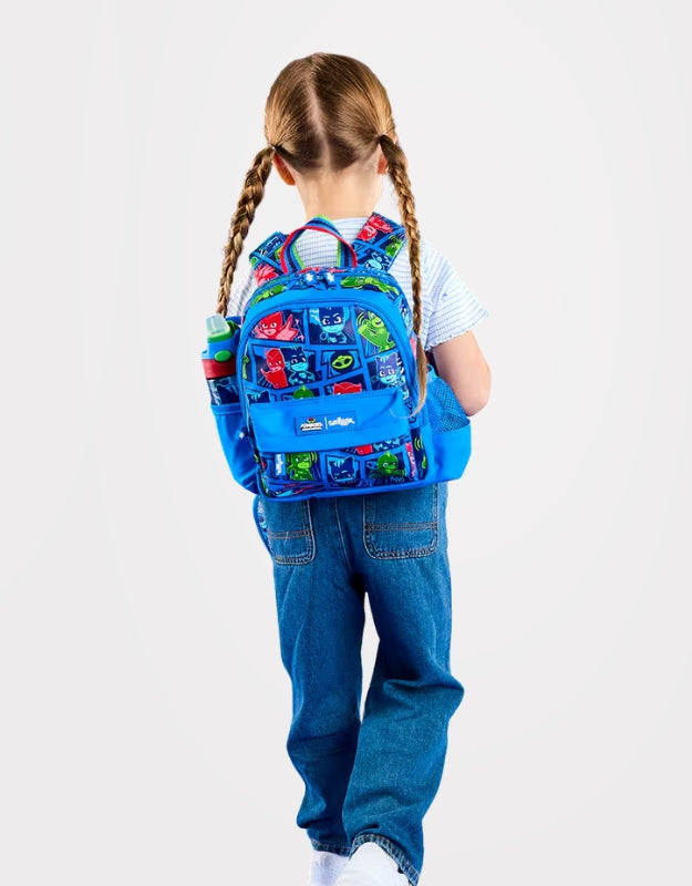 Child wearing a Smiggle PJMasks Power Heroes Teeny Tiny Backpack with colorful character print.